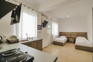 Un televizor și/sau centru de divertisment la Near the Sea Apartments Nano