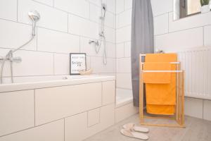 a bathroom with a sink and a towel rack at GUN01-RI Apartment in Haundorf in Haundorf