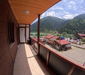 a balcony with a view of a mountain at Kusva Apart in Uzungol