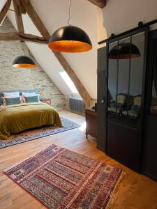 Postel nebo postele na pokoji v ubytování Manoir medieval du XV ieme siècle