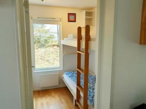 a small room with a bunk bed and a window at Lovely holiday apartment in Mellbystrand in Mellbystrand
