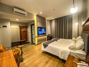 Postel nebo postele na pokoji v ubytování Nata Azana Hotel Solo