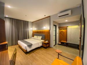 Postel nebo postele na pokoji v ubytování Nata Azana Hotel Solo