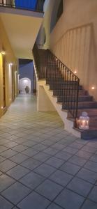 a hallway with a staircase in a building at La Zagara Hotel in Lipari