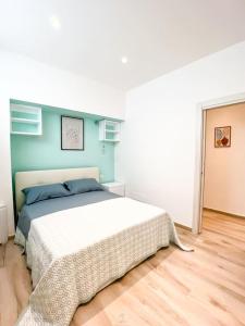 a bedroom with a bed and a blue wall at San Pietro Panoramic House in Galatina