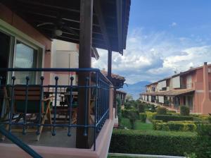 a balcony of a house with a table and chairs at Luxury Beach House 3 Br, AC in Selianitika
