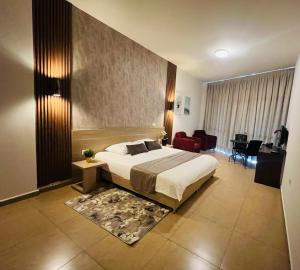 Postel nebo postele na pokoji v ubytování Byblostar Hotel