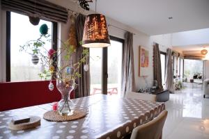 a dining room with a table with a vase on it at Modern 4 Bedroom House Ring of Kerry -Killarney in Killarney