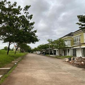 an empty street in a residential neighborhood with houses at Blessimore Springhill 4BR in Palembang