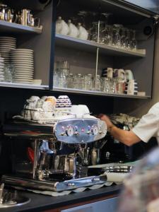 a chef is preparing food in a kitchen at La Camogliese Hotel B&B in Camogli +37 photos