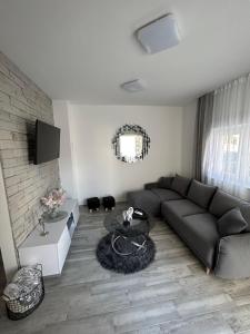 a living room with a couch and a table at Apartman Petra in Vir