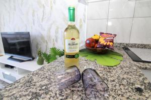 a bottle of wine sitting on top of a counter at Apartments ALOE TOP FLOOR in Playa del Ingles