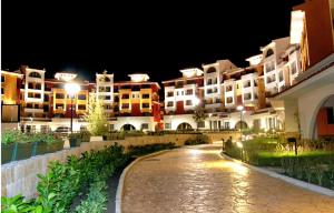 a row of apartment buildings at night at Marina Cape surprise studio in Aheloy