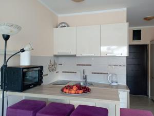 Kuchyň nebo kuchyňský kout v ubytování Apartment Lila