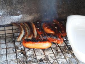 a group of hot dogs and sausages on a grill at Ferienhaus Michi in St. Andrä am Zicksee