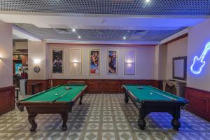 a billiard room with two pool tables in it at Dexon Roma Hotel in Hurghada