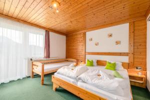 Postel nebo postele na pokoji v ubytování Panoramahotel Stocker