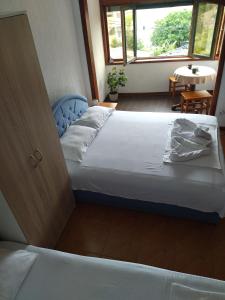 a bedroom with a bed and a window at Apartment Klara in Bar