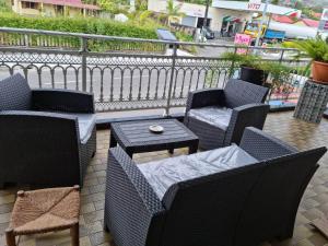a group of chairs and tables on a patio at Chez Camille et Alexis in La Plaine des Palmistes +3 photos