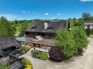 an overhead view of a house with a roof at Gościniec Dębowa Gazdówka in Ustrzyki Dolne