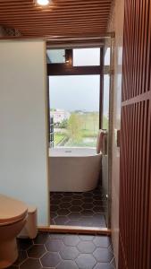 Vannituba majutusasutuses Jiaoxi Pusu Homestay