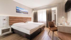 Postel nebo postele na pokoji v ubytování Hotel La Perla