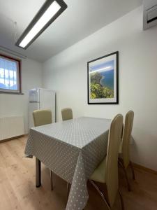 a dining room with a table and chairs at Apartment Sotlar in Izola