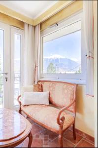 a living room with a couch and a window at Matt's central place in Bled