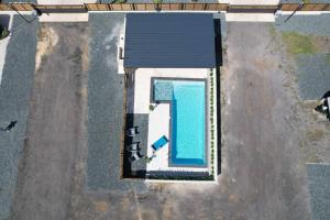 an overhead view of a swimming pool in a yard at iconic rv with pool/ terrace in Arecibo