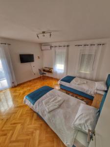 Postel nebo postele na pokoji v ubytování Apartman Cvetkovic