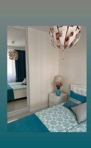 Posteľ alebo postele v izbe v ubytovaní Apartament Jantarowe Zacisze Blue