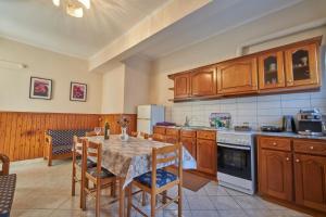Kuchyň nebo kuchyňský kout v ubytování Psarras apartments + 3 fotografie