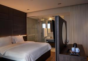 Postel nebo postele na pokoji v ubytování Hotel Trofta