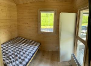 A bed or beds in a room at Domek Szarak