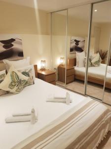 a bedroom with two beds and a mirror at Hotel Villa Maya in Saint-Tropez +37 photos