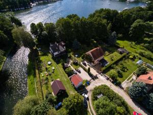 an aerial view of a house next to the water at Domek Natalia in Giżycko