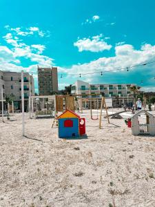 a playground with play equipment on a sandy beach at Hotel Victory in Mamaia +62 photos