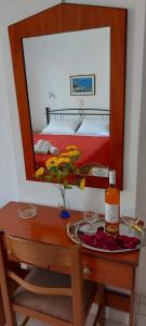A bed or beds in a room at Pelagos Studios
