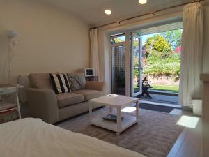 a living room with a couch and a table at Holland House in New Brighton
