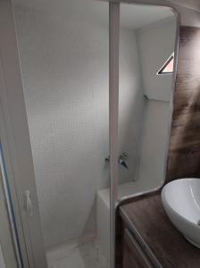 a bathroom with a shower and a sink at BED&BOAT II boatandholiday com in Fano