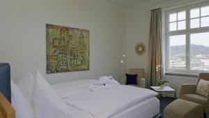Postel nebo postele na pokoji v ubytování Hotel Villa Hügel