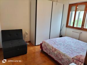 Postel nebo postele na pokoji v ubytování Bilocale Le Rose