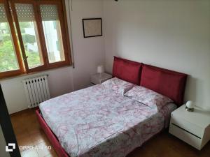 Postel nebo postele na pokoji v ubytování Bilocale Le Rose