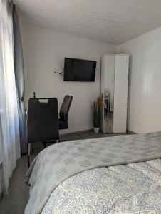 Postel nebo postele na pokoji v ubytování Ferienwohnung an der historischen Stadtmauer + 9 fotografií