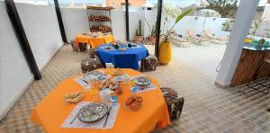 two tables with plates of food on them at CASA ZOUINA in Agadir