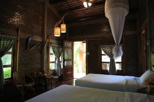 Voodi või voodid majutusasutuse Vamxang Rustic Home toas
