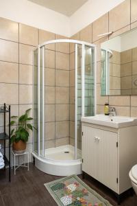 a bathroom with a shower and a sink at Dubrovnik Sunset Apartments in Dubrovnik