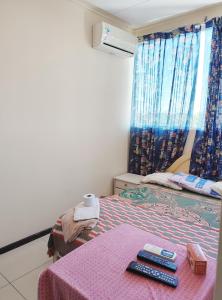 A bed or beds in a room at Santa Cruz Departamentos 2