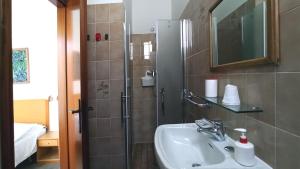 Koupelna v ubytování Hotel La Caravella