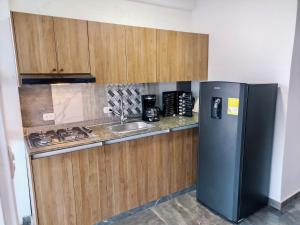 Kuchyň nebo kuchyňský kout v ubytování Paradisíaco Apt 360º Palmira
